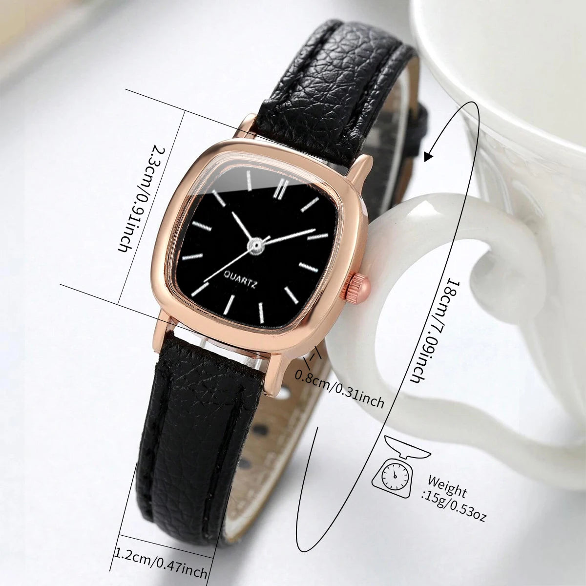 Black wristwatch with rose gold case on a white background