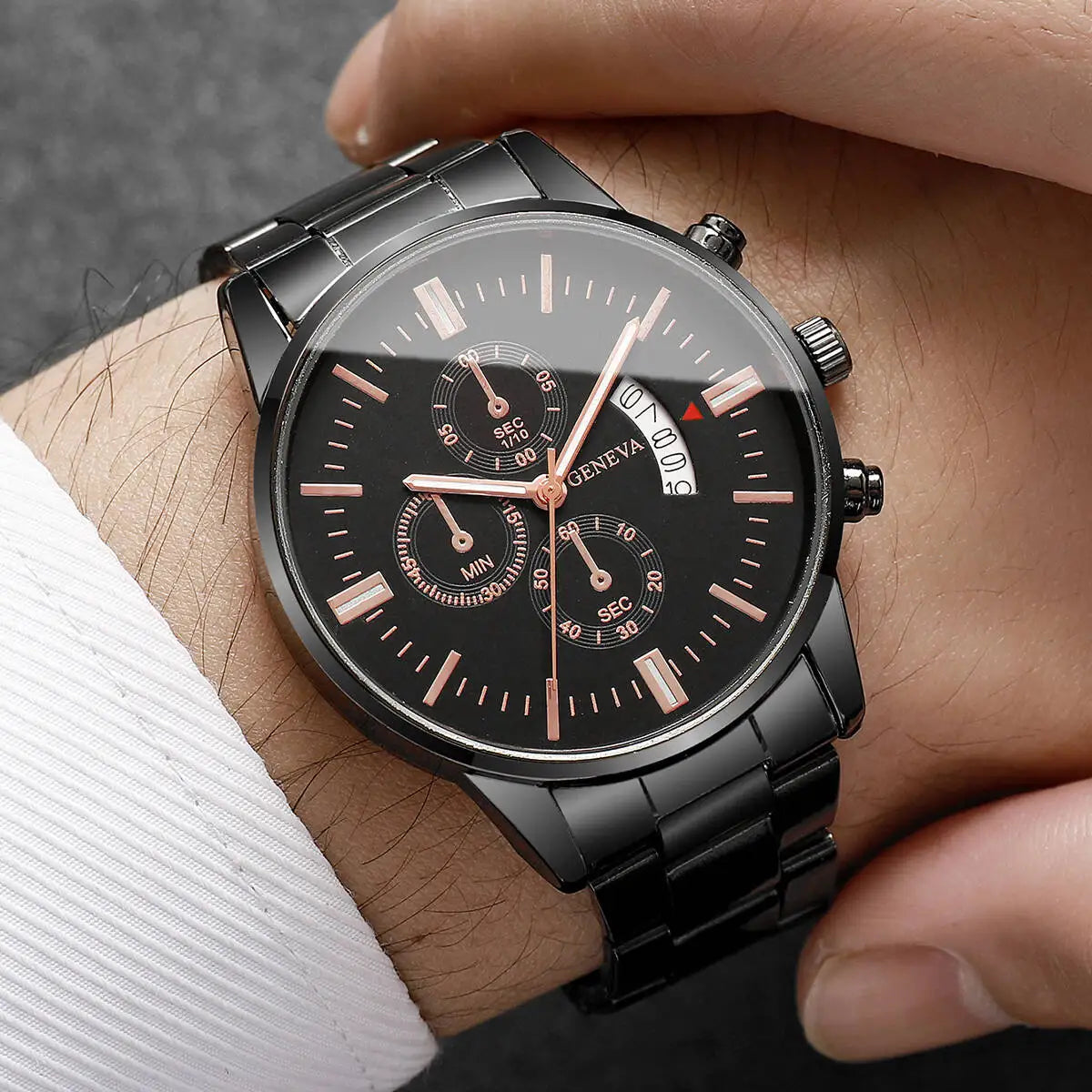 Black wristwatch with detailed face on a person's wrist