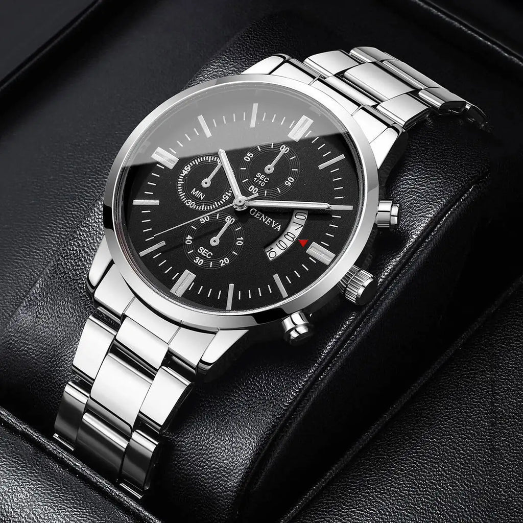 Silver wristwatch with black dial on a dark background