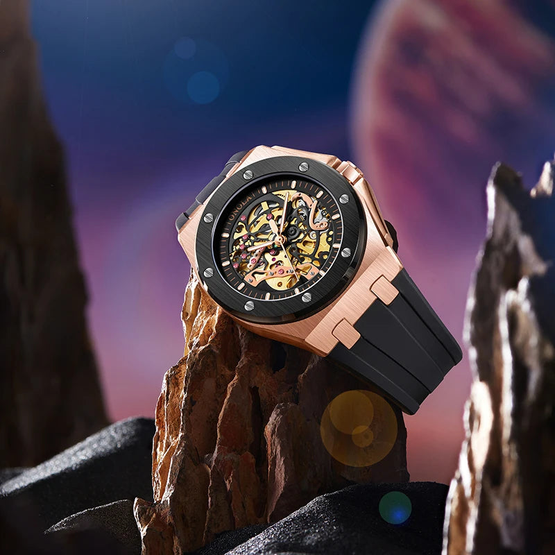 Luxury watch with black and rose gold design on a rocky surface