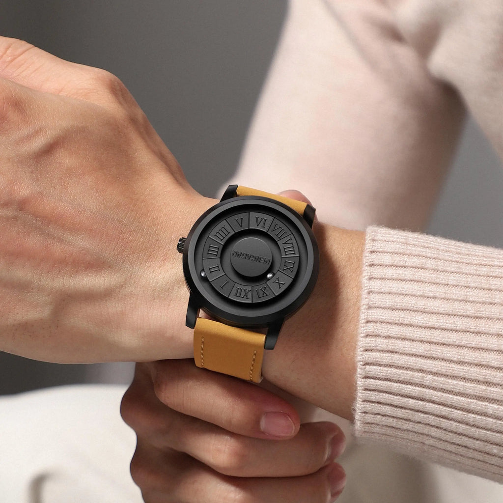 Person wearing a watch with a black face and yellow strap on a neutral background