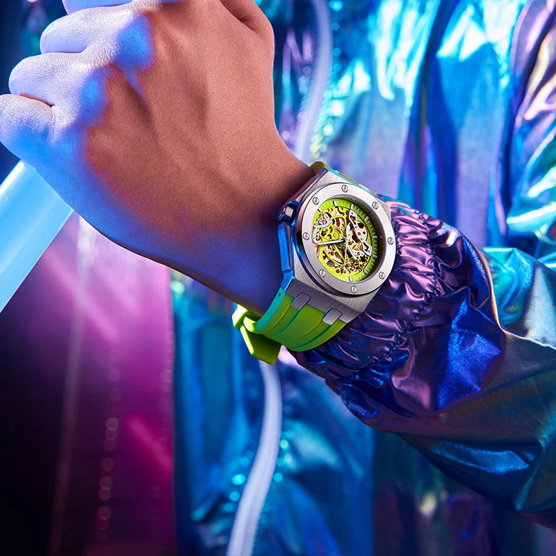Close-up of a wrist wearing a colorful watch with a vibrant background