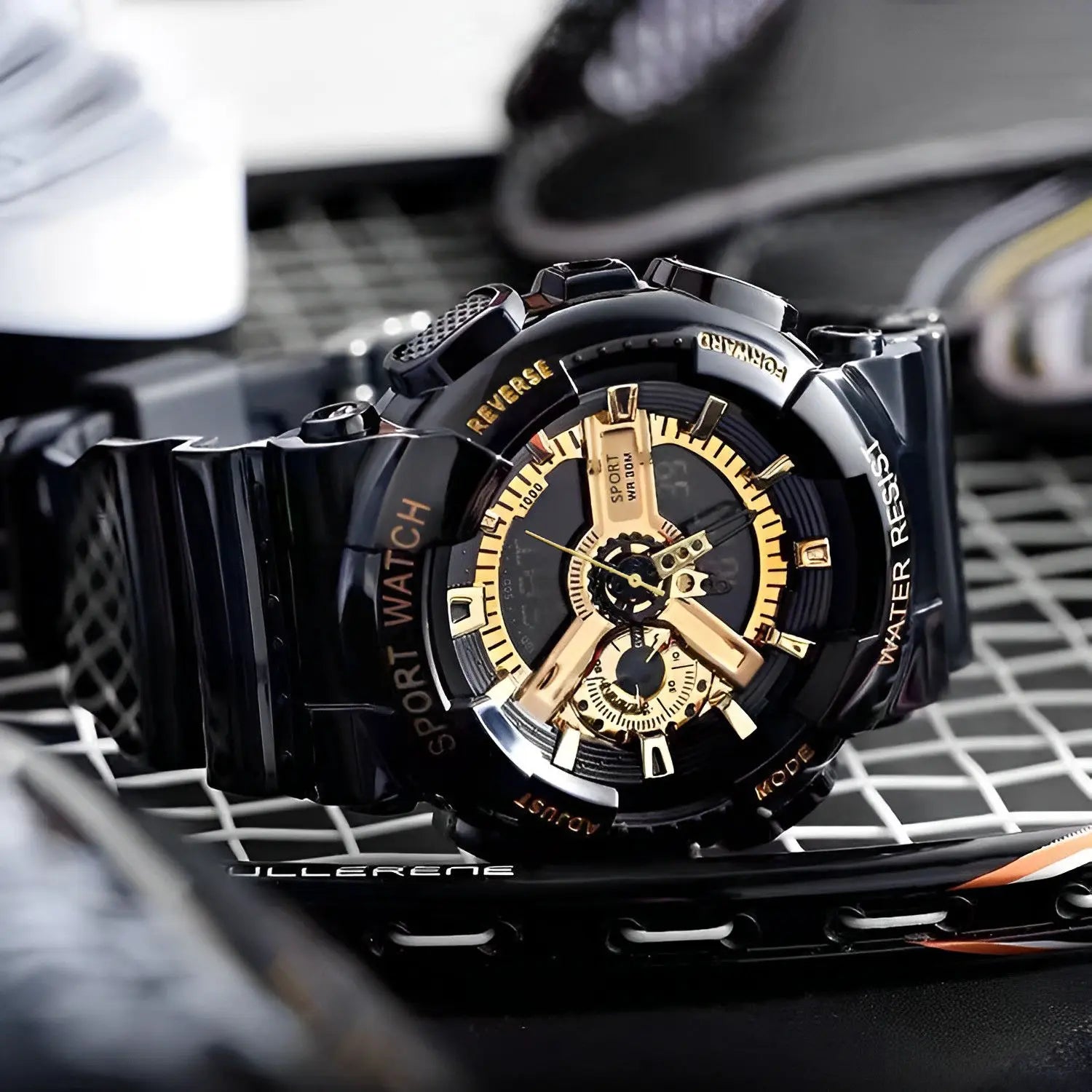 Black and gold watch with detailed face on a textured surface