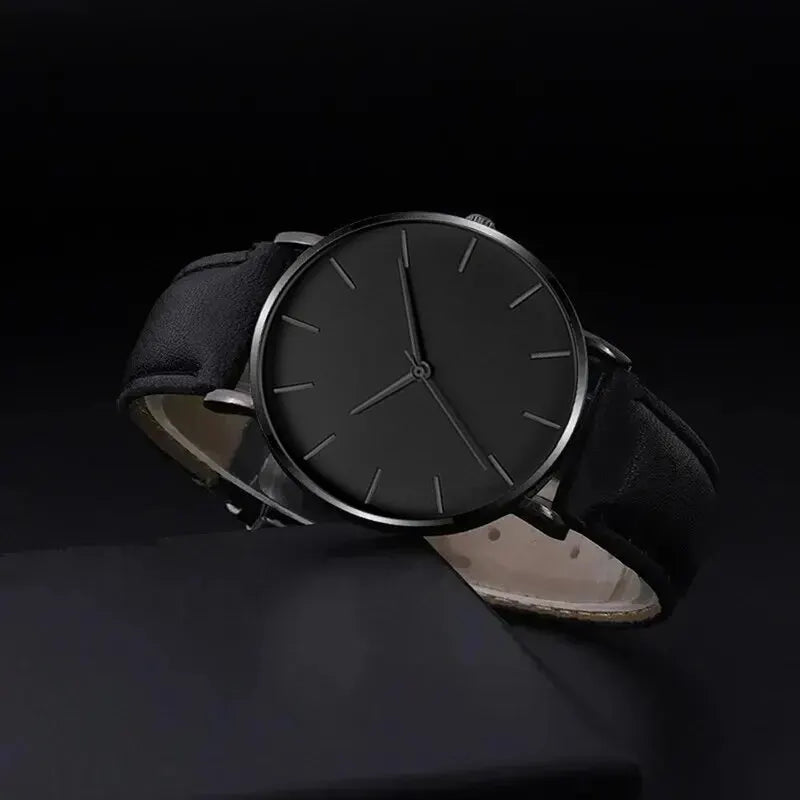 Black wristwatch with a dark background