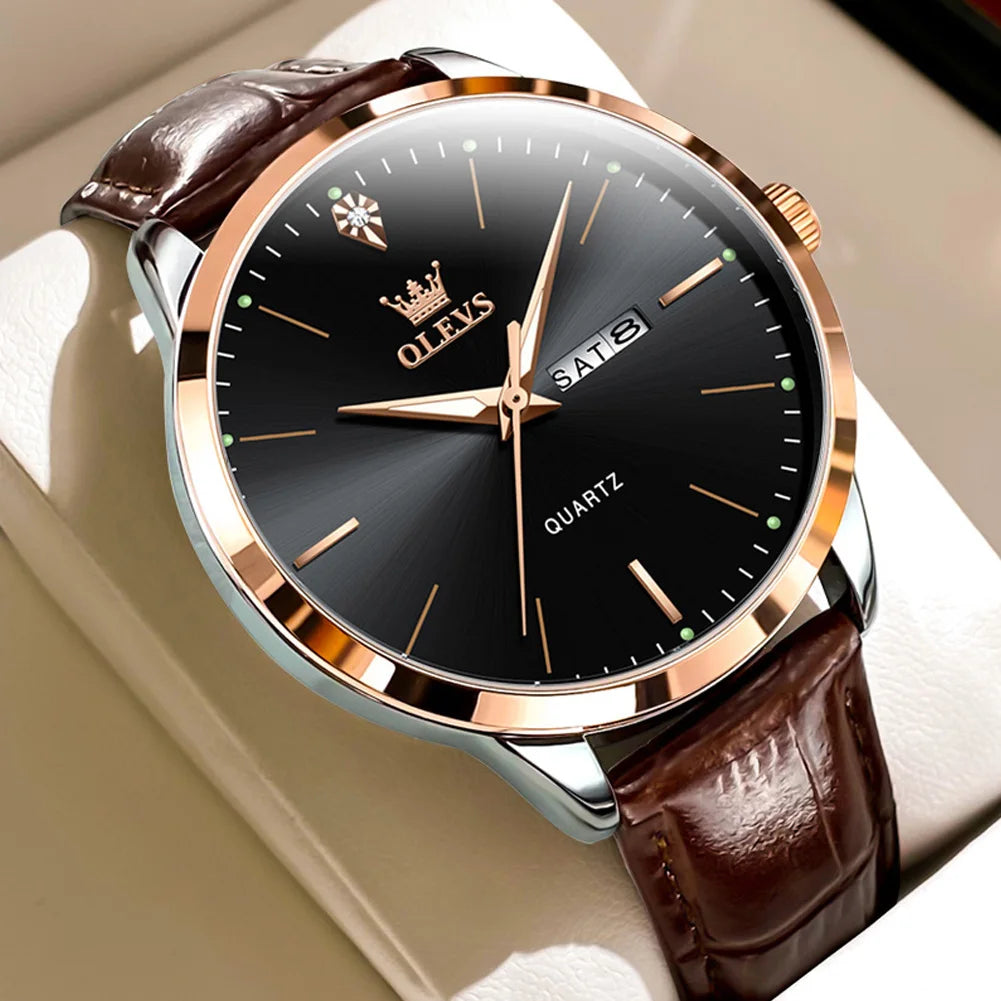 Watch with brown leather strap and black dial on a white surface