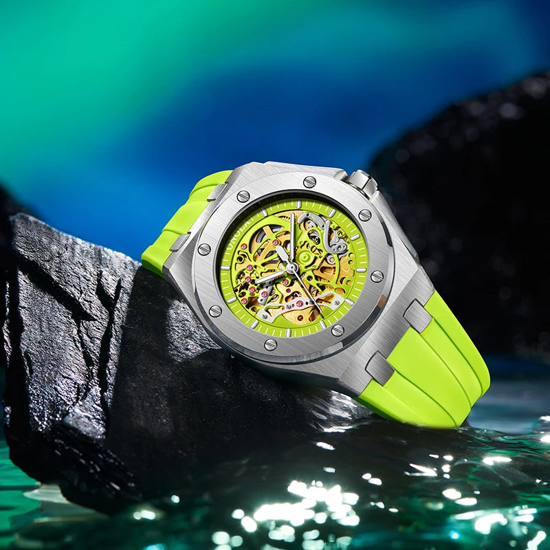 Watch with a green strap and yellow face on a dark rock with water background