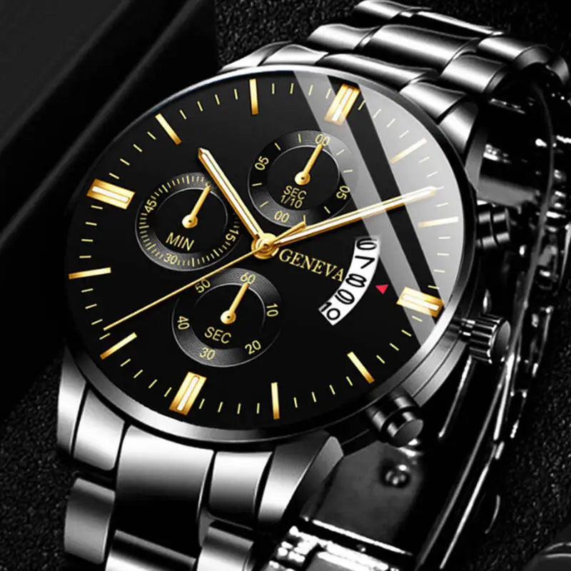 Luxury watch with black dial and gold accents on a dark background