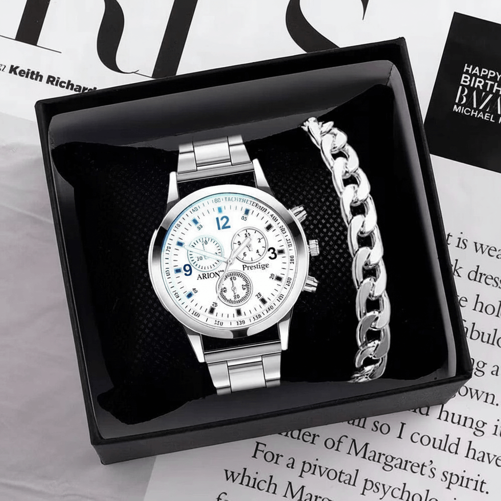 Silver watch and bracelet set in a black box on a magazine background